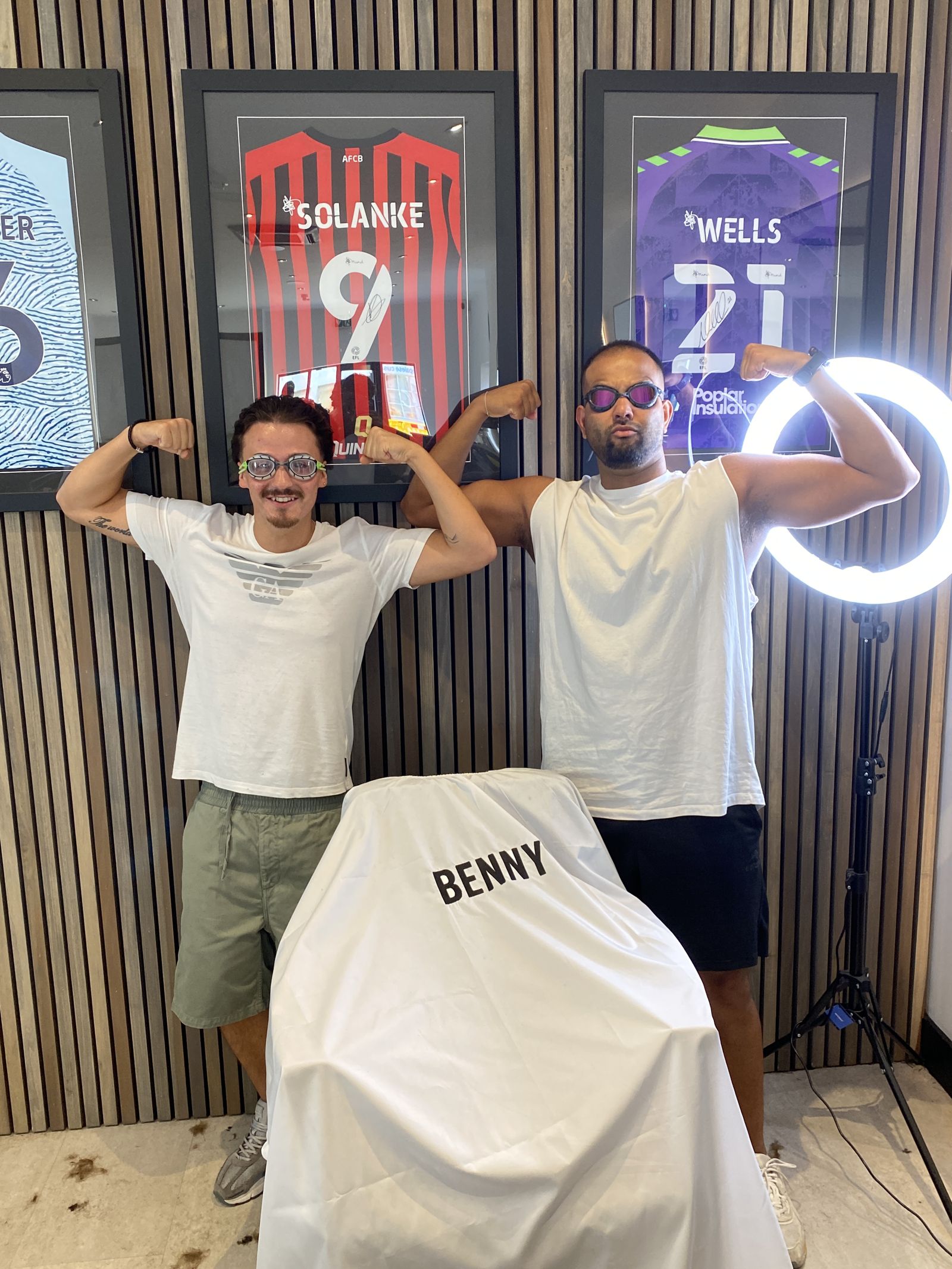 Flexing in front of signed AFC Bournemouth shirts