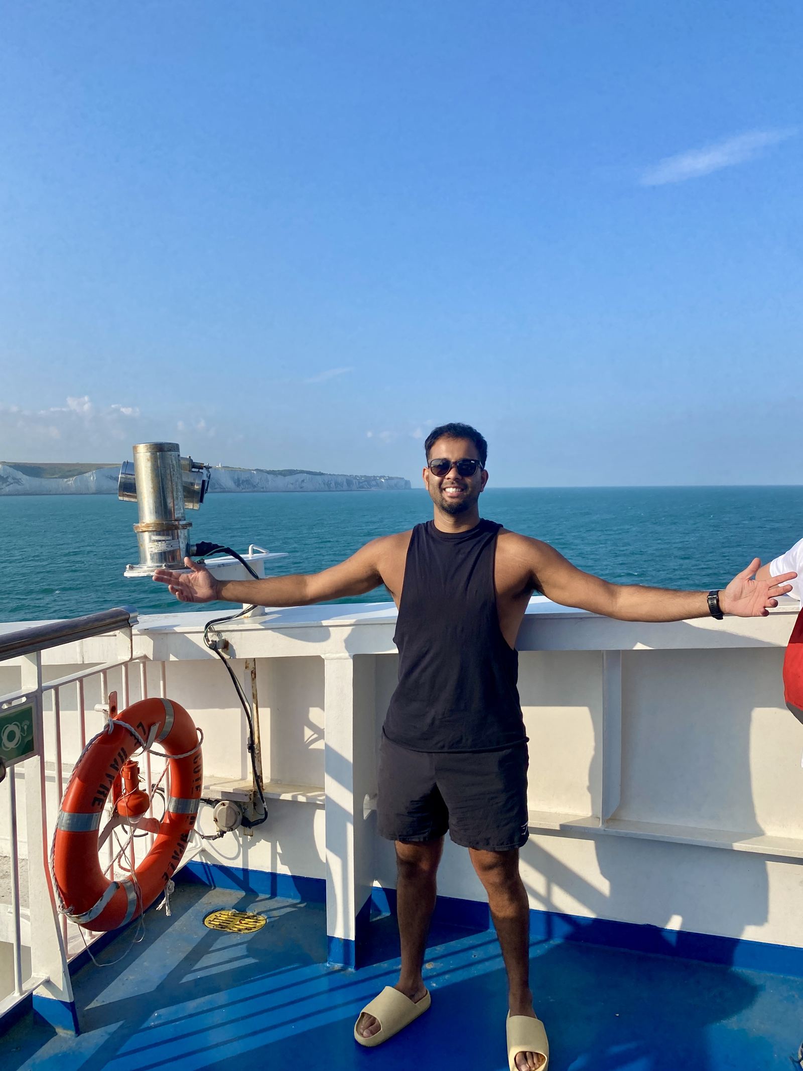 On the ferry, white cliffs in the background