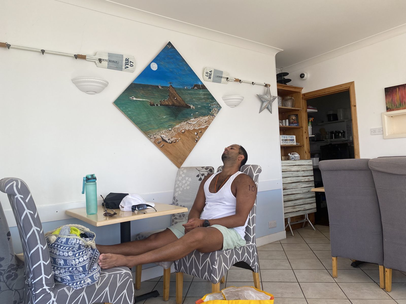 Resting in a beachside cafe after an open water swim